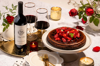 Napa Cabernet with two glasses and a cheesecake