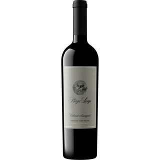 A bottle of Stag's Leap Oakville Cabernet Sauvignon, featuring a dark glass bottle with  a light gray label with black text and a circular crest.