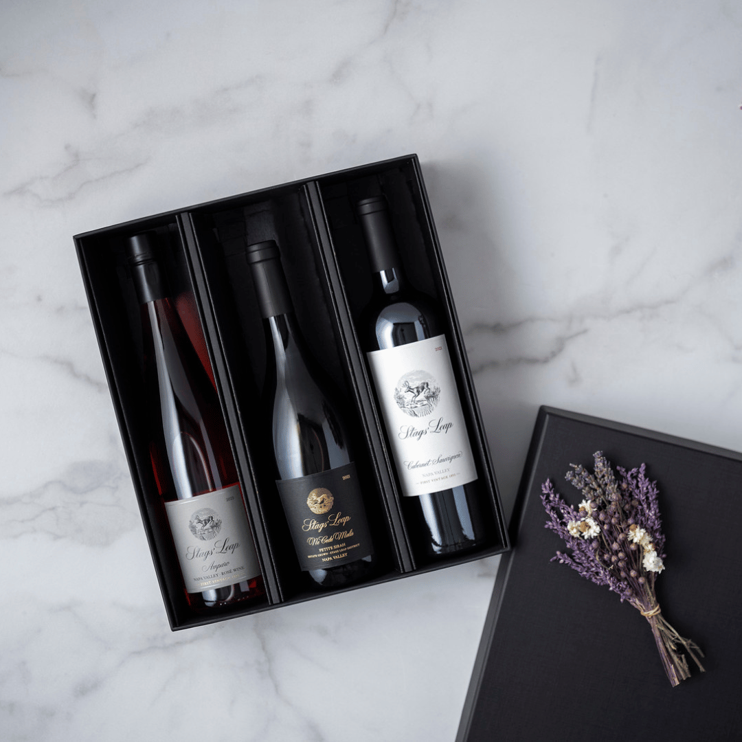 Three bottle gift set featuring 2021 Ne Cede Malis Petite Sirah 2023 Amparo Rose 2022 Napa Valley Cabernet and dried flowers.