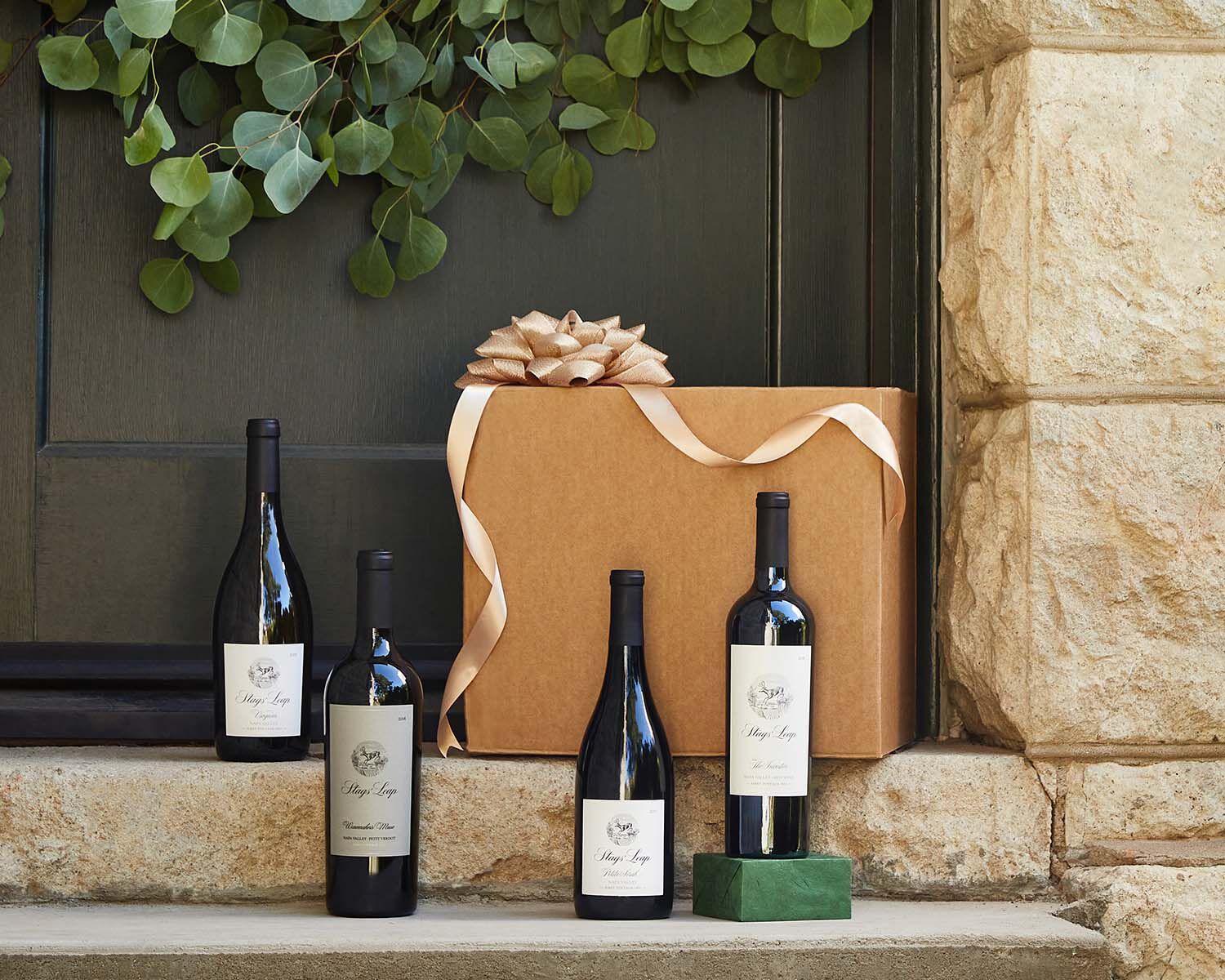 Stags' Leap bottles with gift box on porch